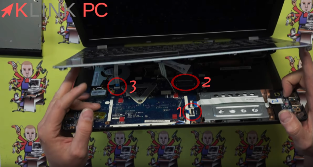 View of trackpad, keyboard and on/off button cables